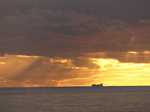 FZ010411 Boat on horizon at sunset.jpg